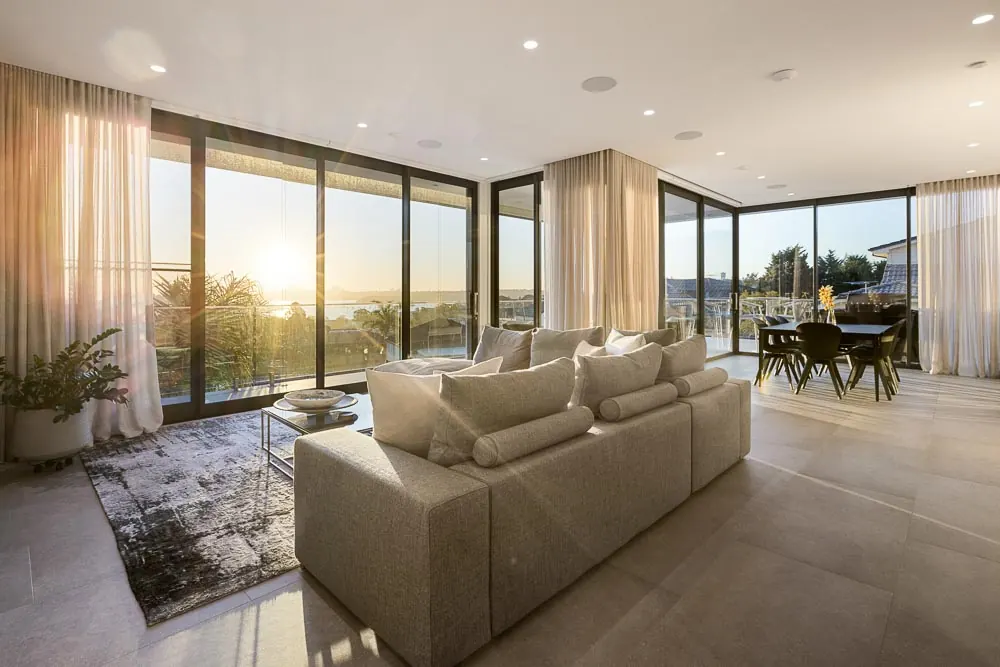 Open living area with city views at sunset