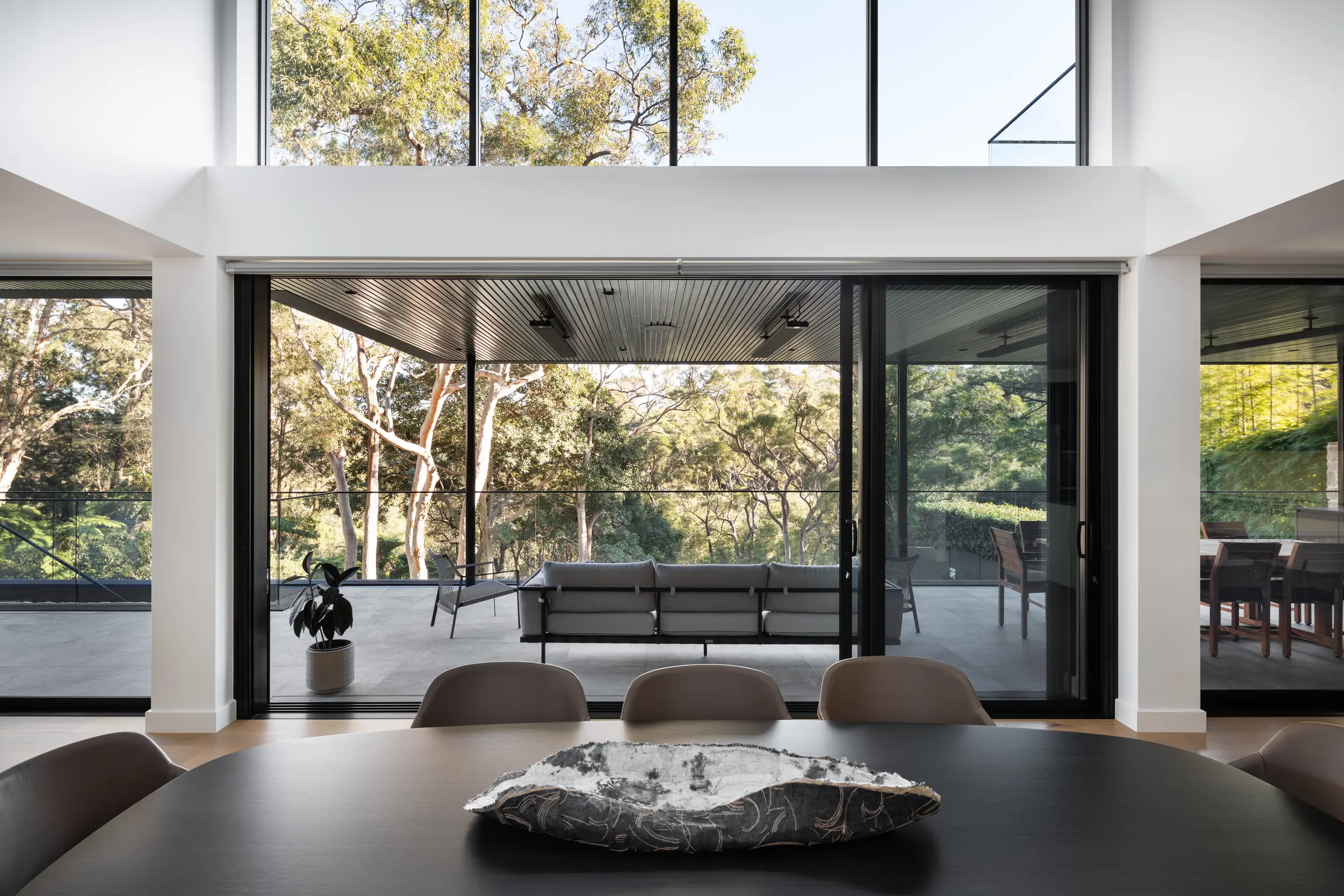 Open dining pavilion looking into bushland